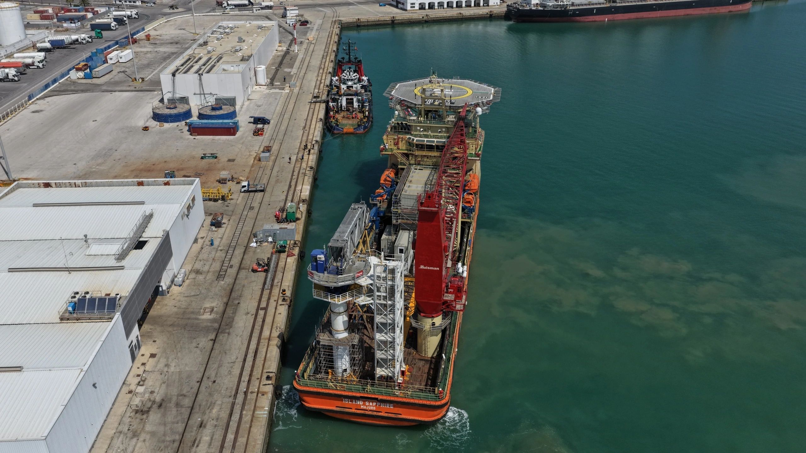 Aerial view offshore supply vessel docked at port